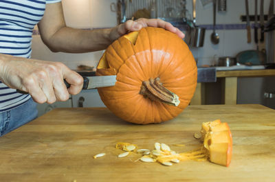 Midsection of man preparing food