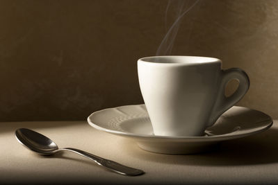 Close-up of coffee cup on table