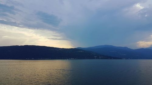 Scenic view of lake against sky during sunset