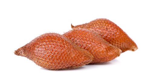 Close-up of orange fish on white background