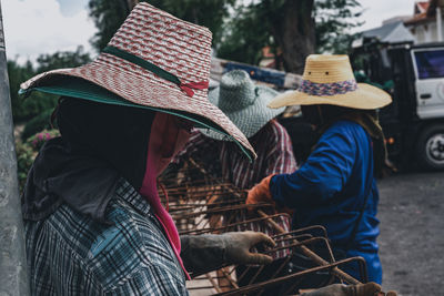 Rear view of people working