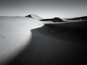 Scenic view of desert against clear sky