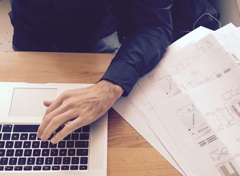 High angle view of man working on table