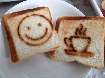 Close-up of smiley face on plate