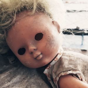 Close-up of broken doll