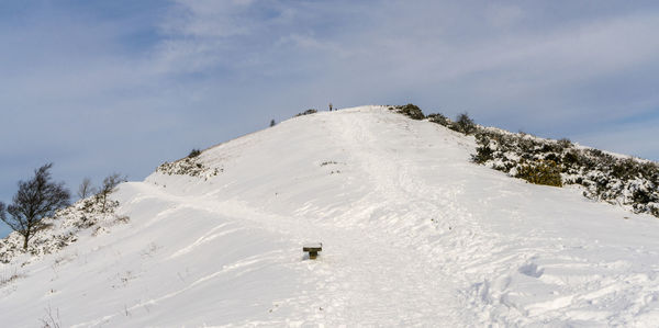 Low angle view of snowcapped mountain against sky