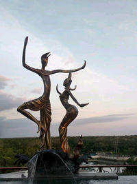 Statue against sky during sunset