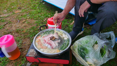 Midsection of man preparing food