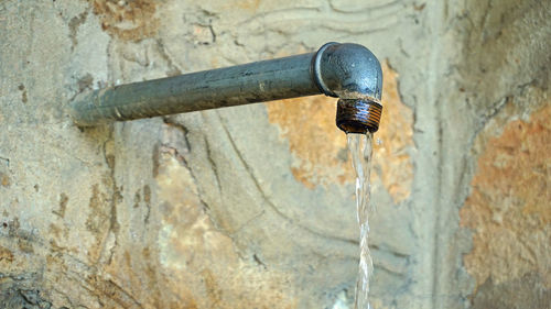 Close-up of water drops on old wall