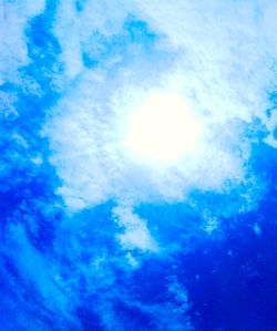 Low angle view of blue sky and clouds