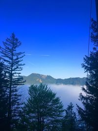 Scenic view of mountains against clear blue sky