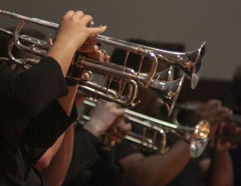 Midsection of men playing musical instrument