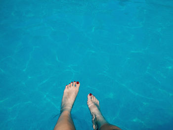 Low section of woman in swimming pool