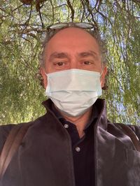 Portrait of a man against plants