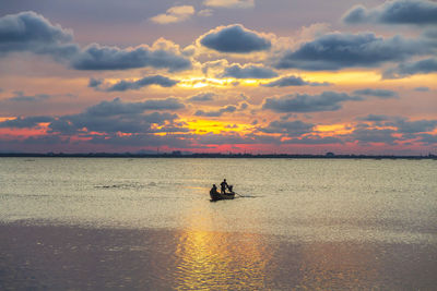 Silhouette of a local fishing boat at the sea in yaring district, pattani, thailand