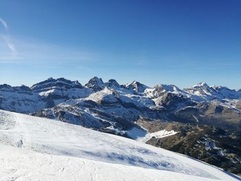 Scenic view of mountains against sky during winter