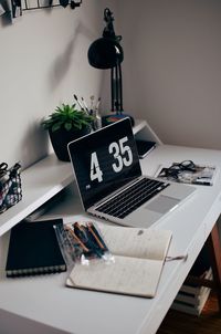 Close-up of laptop on table at home