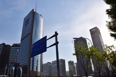 Low angle view of skyscrapers against sky