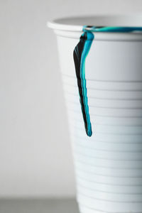 Close-up of blue paint on table