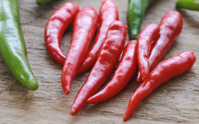 Close-up of red chili peppers on table