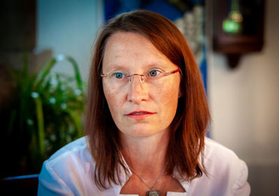 Woman in eyeglasses looking away