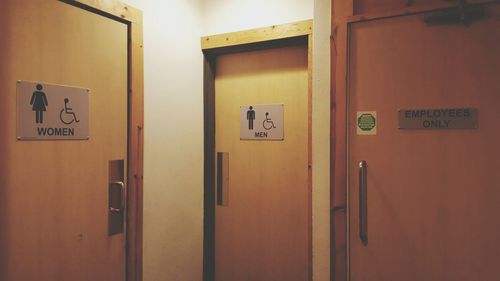 Female and male sign on door