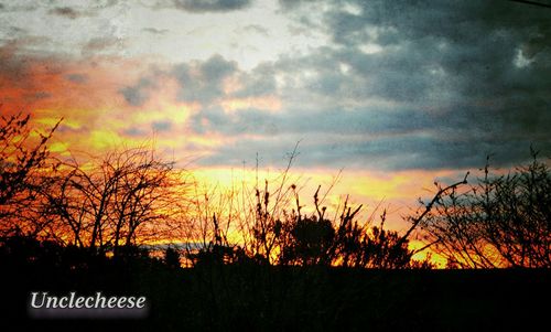 Scenic view of landscape against sky at sunset