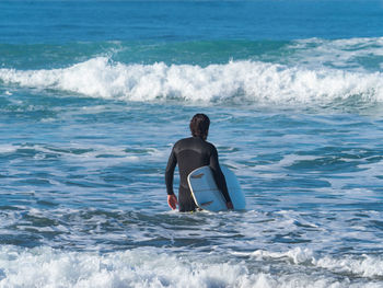 Rear view of man on beach