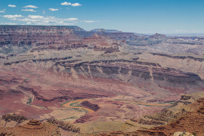 Aerial view of landscape with mountain range in background