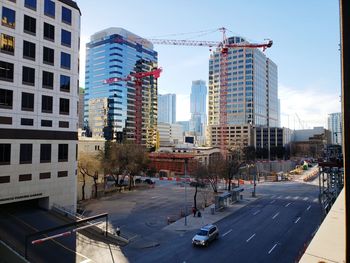 City street amidst buildings against sky