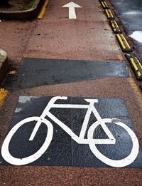 High angle view of bicycle sign on road
