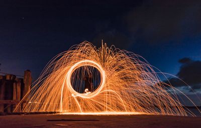 Light painting against sky at night