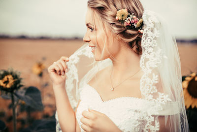 Beautiful bride looking away outdoors