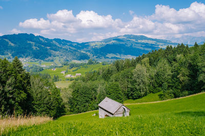 Scenic view of landscape and mountains against sky