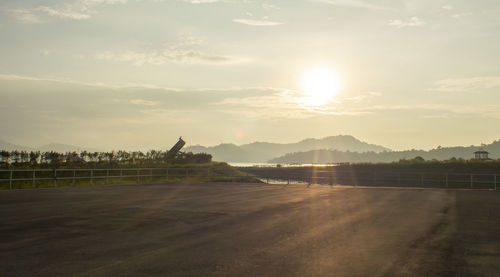 Scenic view of road against sky during sunset