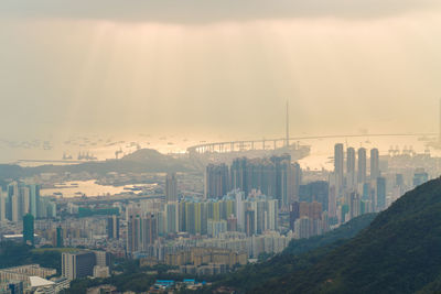 High angle view of buildings in city against sky