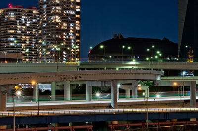 Illuminated buildings in city at night