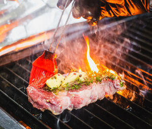 Close-up of meat on barbecue grill