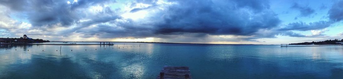 Panoramic view of sea against blue sky