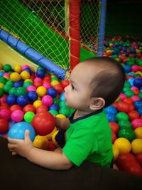 Cute baby boy playing with ball