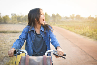 Young girl riding bicycle