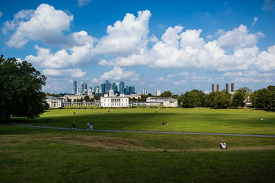 Scenic view of field against cloudy sky