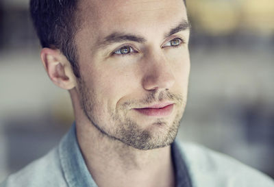 Mid adult waiter looking away in restaurant