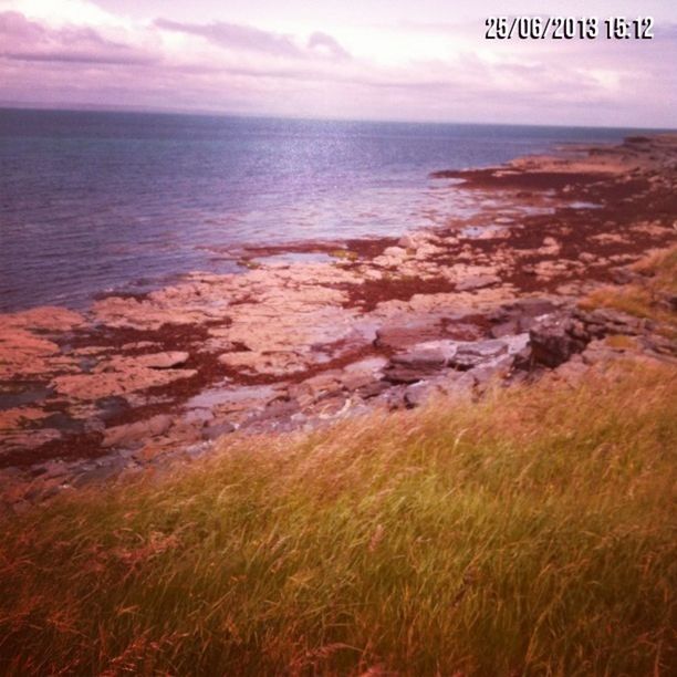 sea, horizon over water, water, tranquil scene, tranquility, sky, scenics, beauty in nature, nature, beach, shore, idyllic, rock - object, coastline, cloud - sky, no people, outdoors, cloud, remote, non-urban scene