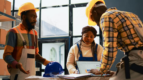 Rear view of business colleagues working in office