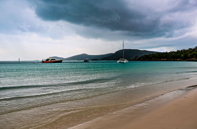 Scenic view of sea against cloudy sky