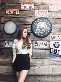 Woman with text on wall