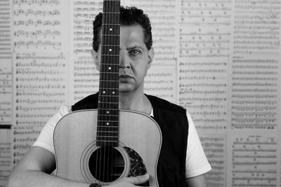 Cropped image of man playing guitar