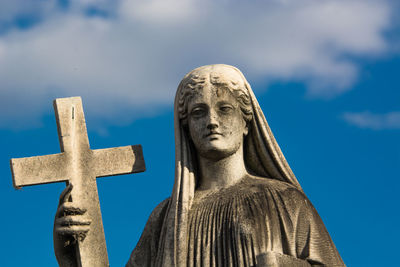 Low angle view of statue against sky