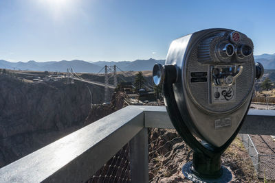 View of coin-operated binoculars against mountain range